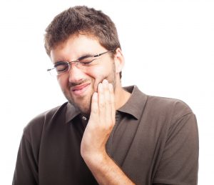 Man suffering with tooth pain